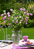 Pink Campanula on table in open air