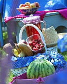 Strawberries, bread and wine in picnic basket
