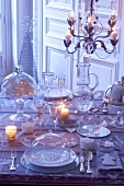A table laid with glass crockery for Christmas