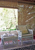 Roofed terrace with rattan furniture