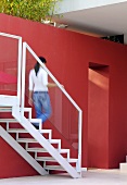 Woman going downstairs (Villa Bamboo, Southern France)