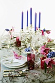 Festive table with floral decorations and candelabrum