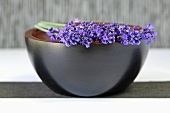 Springs of lavender with flowers on a bowl