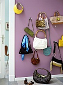 Handbags hanging on a wall