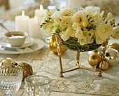 Tea table with Christmas decorations and flowers