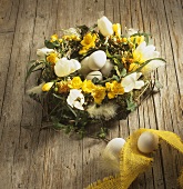 Easter arrangement of spring flowers and Easter eggs