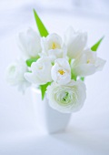 A bouquet of white tulips in a vase