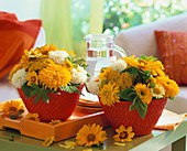 Summery arrangements of sunflowers, achillea and dahlias