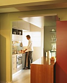 A man standing in a kitchen