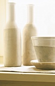 Two ceramic bottles and ceramic pots