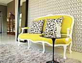 Couch against patterned wallpaper