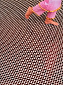 Child's feet on tiled floor