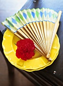 Spanish fan and carnation on a plate (table decoration)