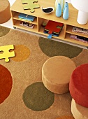 Detail of rug, pouffes and shelves