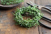 A rosemary wreath and a pair of scissors