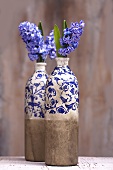 Hyacinths in painted bottles