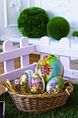 Egg-shaped gift boxes with Easter motifs