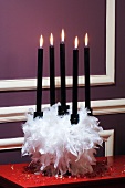 Candle holder with five burning candles