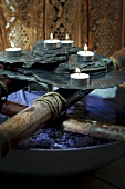 Rocks and tealights in spa (decoration)