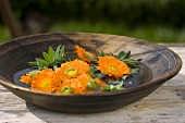Marigolds in a dish of water