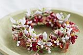 Small wreath of artificial berries & flowers with snowdrops