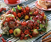 Wreath of apples, rose hips and Chinese lanterns