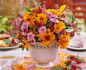 Arrangement of chrysanthemums on tea table