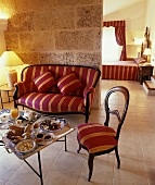 Breakfast tray on small table in living room, couch & chair