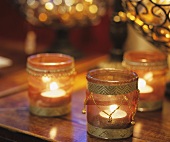 Tealights in glasses used as table decorations
