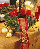 Advent wreath with red candles and ribbon