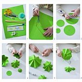 Child making a paper Christmas tree