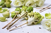 Romanesco florets and Brussels sprouts on wooden skewers