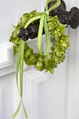 Small hop wreath on a door handle