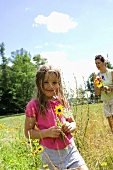 Mother and Daughter Picking Wildflowers