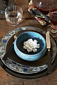 Place Setting with White Flower in Bowl