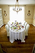 Dining Table Set with Many Assorted Cakes; In Dining Room