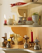 Various candles on a shelf