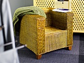 Basket chair with a green throw