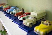 Tin cars on a shelf