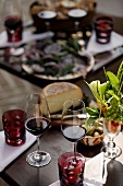 Red wine glasses and starters on a decorated table