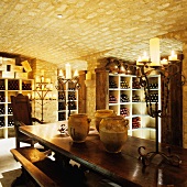 An old wine cellar with a vaulted ceiling lit by candle light