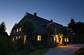 Night in the countryside - an illuminated farm house