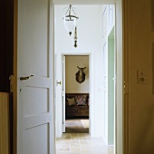 A view of an animal through an anteroom in a country house
