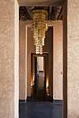 A chandelier with mother-of-pearl disks in the hallway of a Mediterranean house