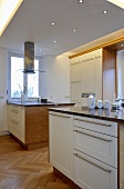 Double central island units in contemporary kitchen