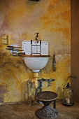 Wall mounted washbasin in rustic bathroom