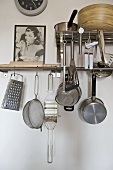 Cookware hanging from steel bar