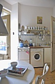 Modern kitchen with freestanding oven and washing machine