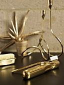 Various golden bath utensils (toothbrush, nail brush, etc)