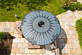 A view of a grey sunshade on a terrace